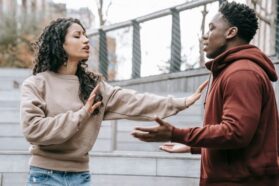 Pexels - free to use https://www.pexels.com/photo/multiracial-couple-having-conflict-on-street-6147235/